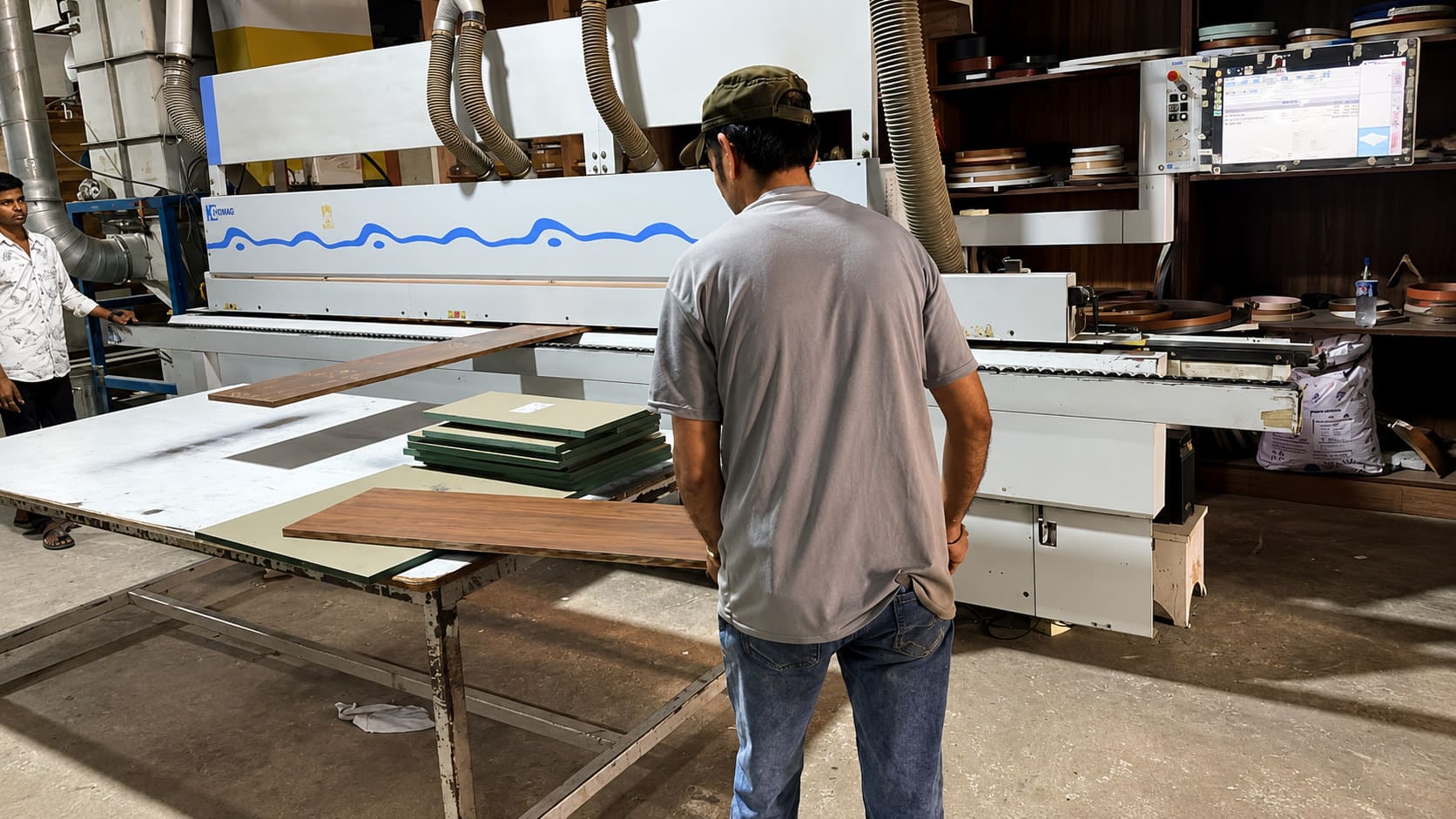 Operator running HOMAG edge banding line